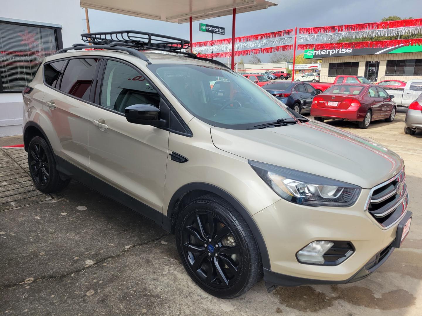 2018 Gold Ford Escape (1FMCU9GD5JU) with an 1.5L I4 F DOHC 16V engine, Automatic transmission, located at 503 West Court, Seguin, TX, 78155, (830) 379-3373, 29.568621, -97.969803 - 2018 Ford Escape SE 4WD with a 1.5L I4 F DOHC 16V, Automatic, Tilt, Cruise, AM/FM/CD Touchscreen Stereo, Power Windows, Locks, Seat and Side Mirrors, Bluetooth, Navigation, Automatic Headlights, Dual Climate Control, Rear A/C, Heated Seats, Tinted Windows, Luggage Rack, Backup Camera, Bumper Sensors - Photo#1